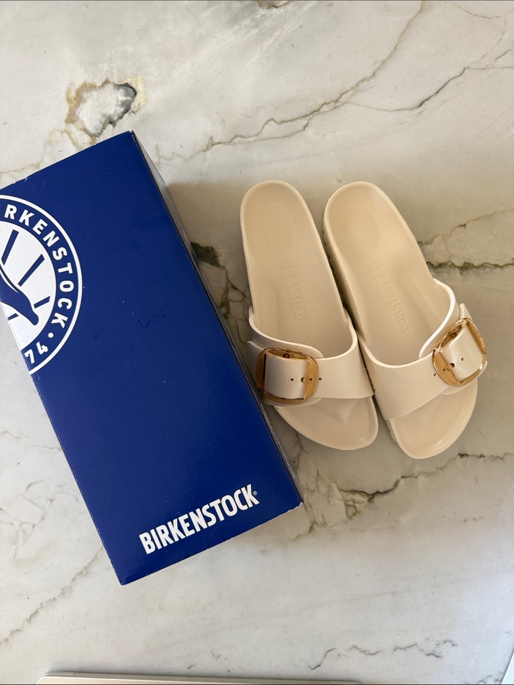 Birkenstock EVA Single-Strap Slides in Cream with Gold Buckle